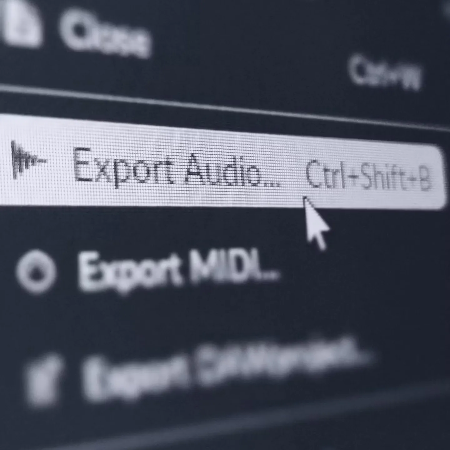 A computer screen displays a menu with "Export Audio" highlighted, accompanied by the shortcut "Ctrl+Shift+B." A cursor hovers over it, indicating an action.